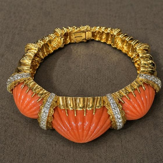Signed David Webb bracelet with carved natural coral and pave diamond bands in 18k gold