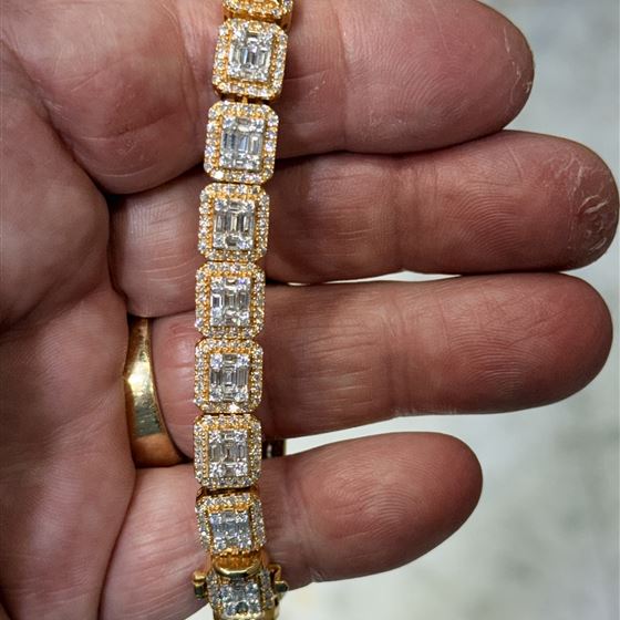 14K yellow gold diamond tennis bracelet with baguette clusters and round brilliant halos
