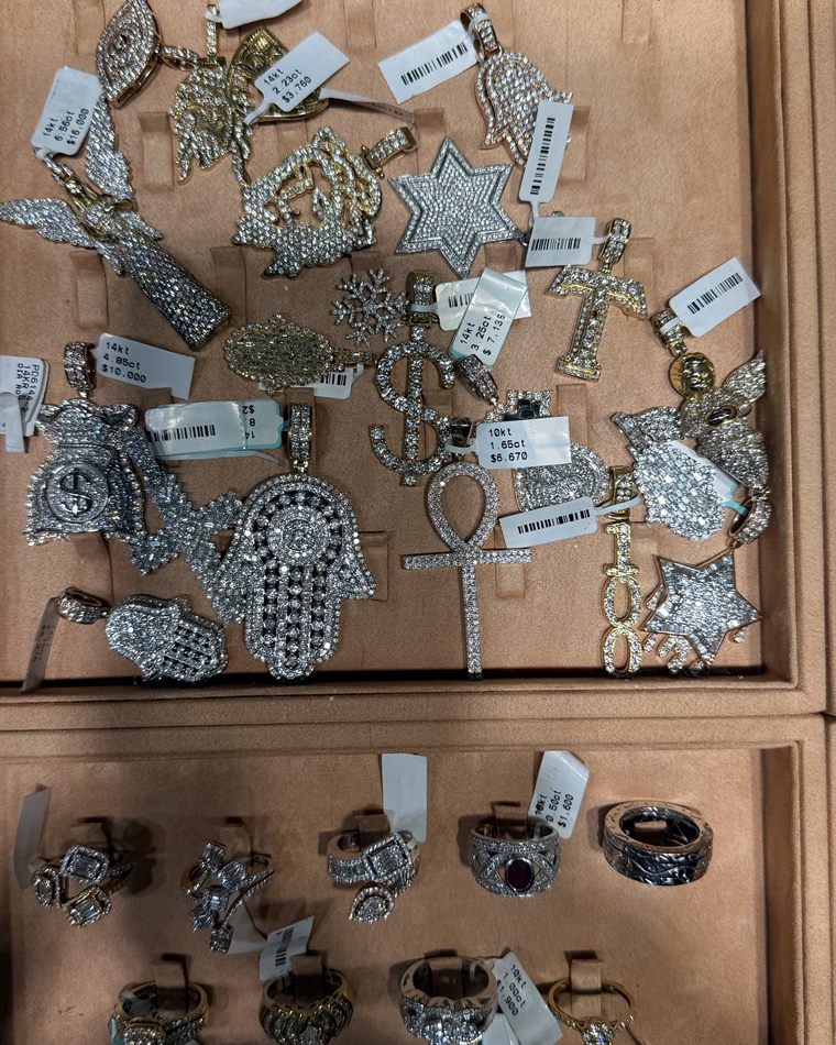 Diamond symbol pendants including ankh, star and hamsa